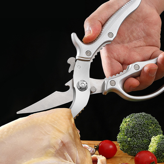 Multi-functional kitchen scissors 🍗 One blade, multiple uses: fish scaler + walnut cracker + bottle opener. Serrated edges for a non-slip grip. Features a safety lock to prevent cuts. ✂️